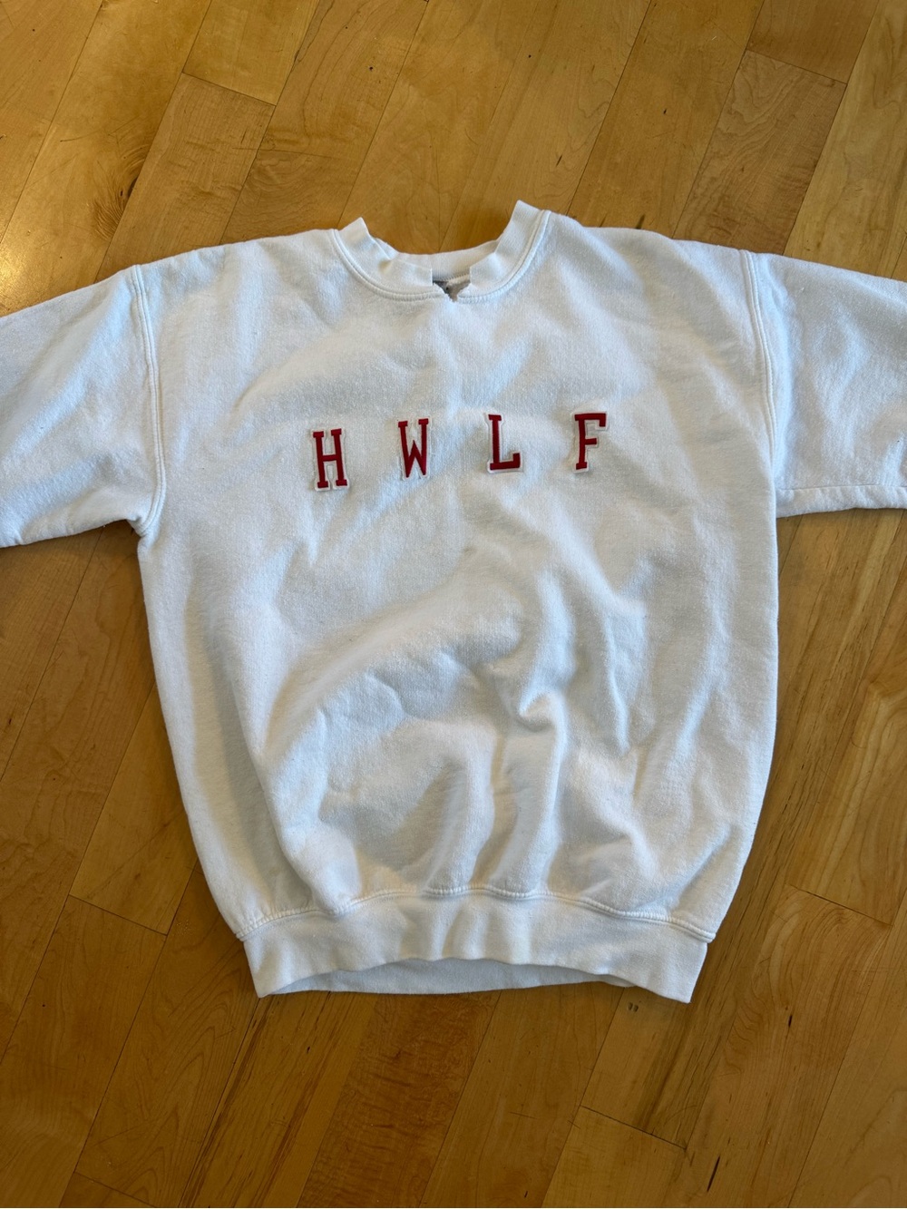 White Sweatshirt with Red HWLF Lettering